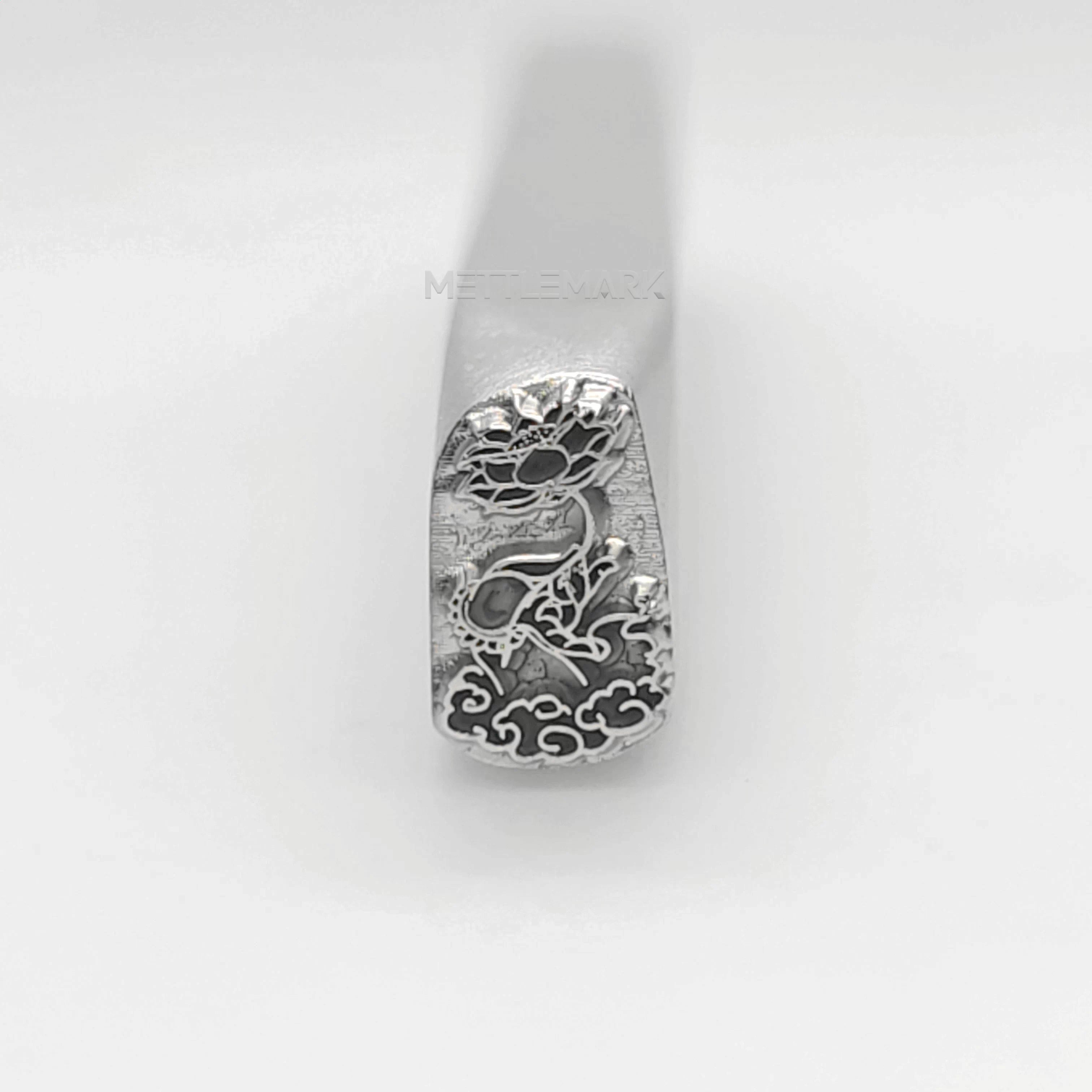Metal stamp with Holding a lotus flower