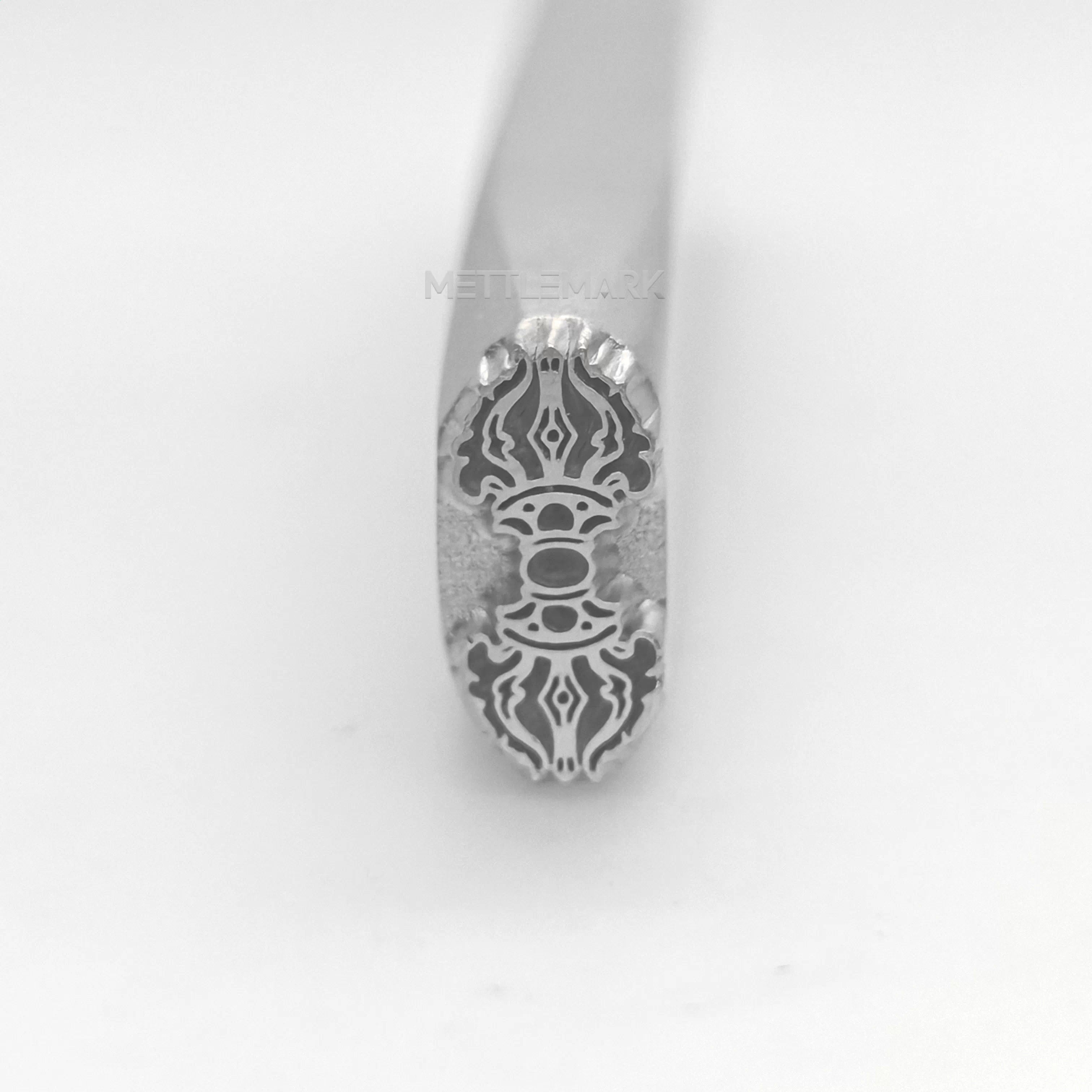 Metal stamping tool with Buddhism sign