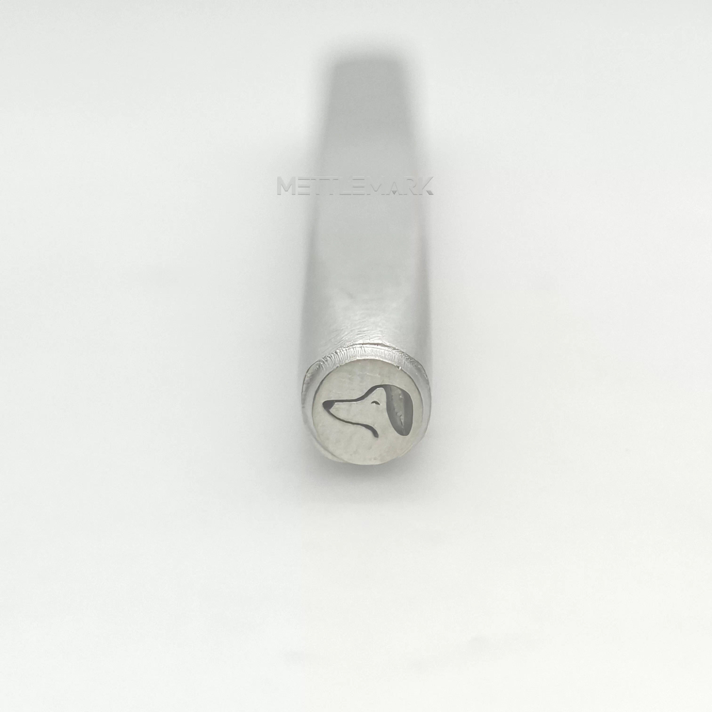 Metal stamp with a dog design