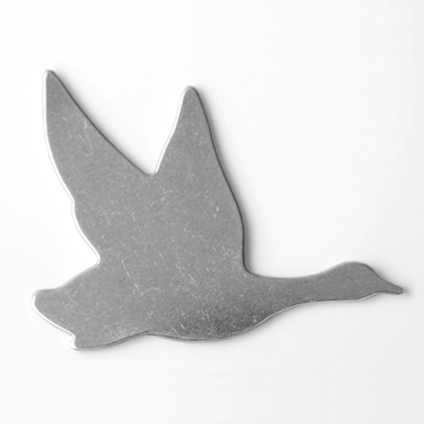Metallic bird-shaped object on a white background MetalStampingBlank