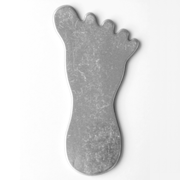Gray foot-shaped mat on a white background MetalStampingBlank