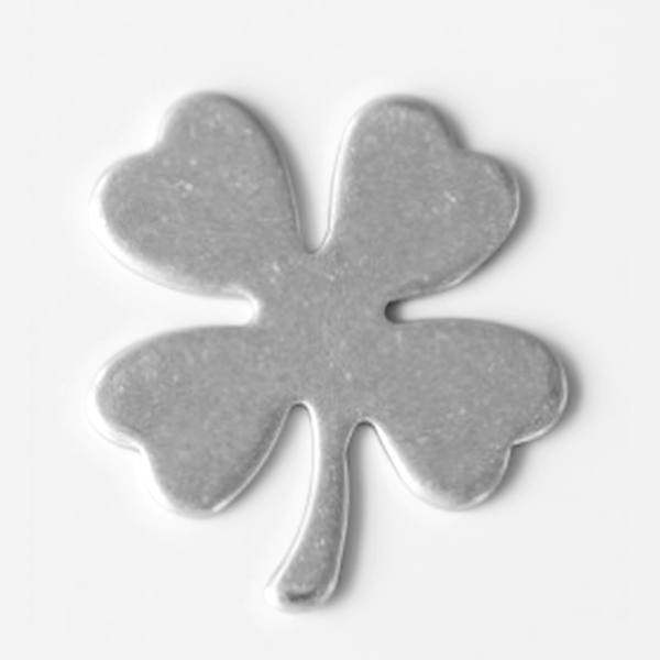 Metallic four-leaf clover charm on a white background MetalStampingBlank