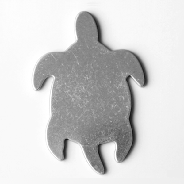 Gray turtle-shaped bottle opener on a white background MetalStampingBlank