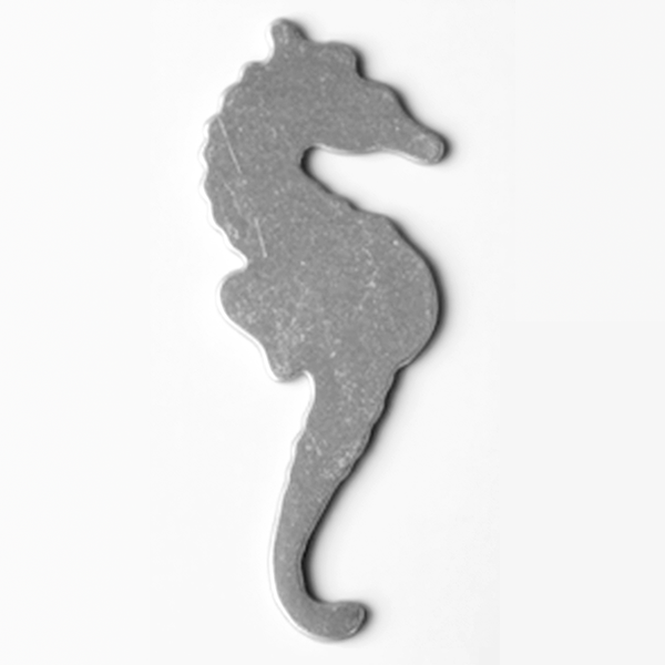 Metallic silver seahorse-shaped object on a white background MetalStampingBlank