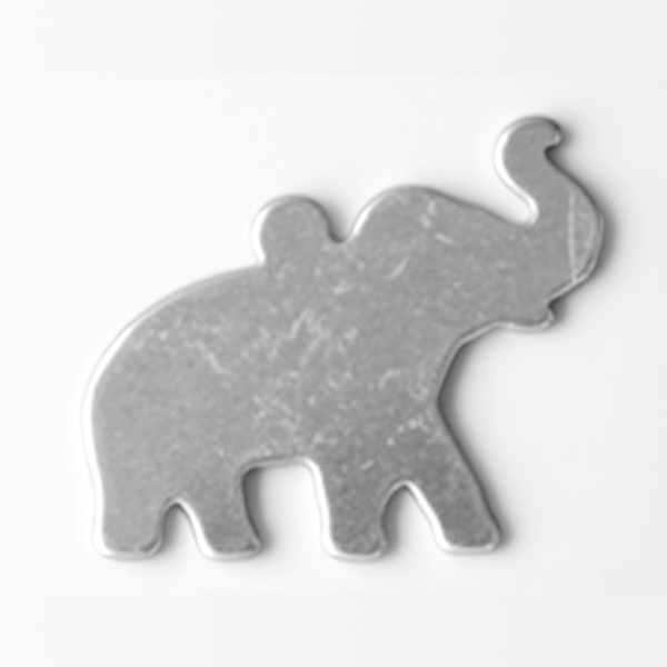 Metallic elephant-shaped object on a white background MetalStampingBlank