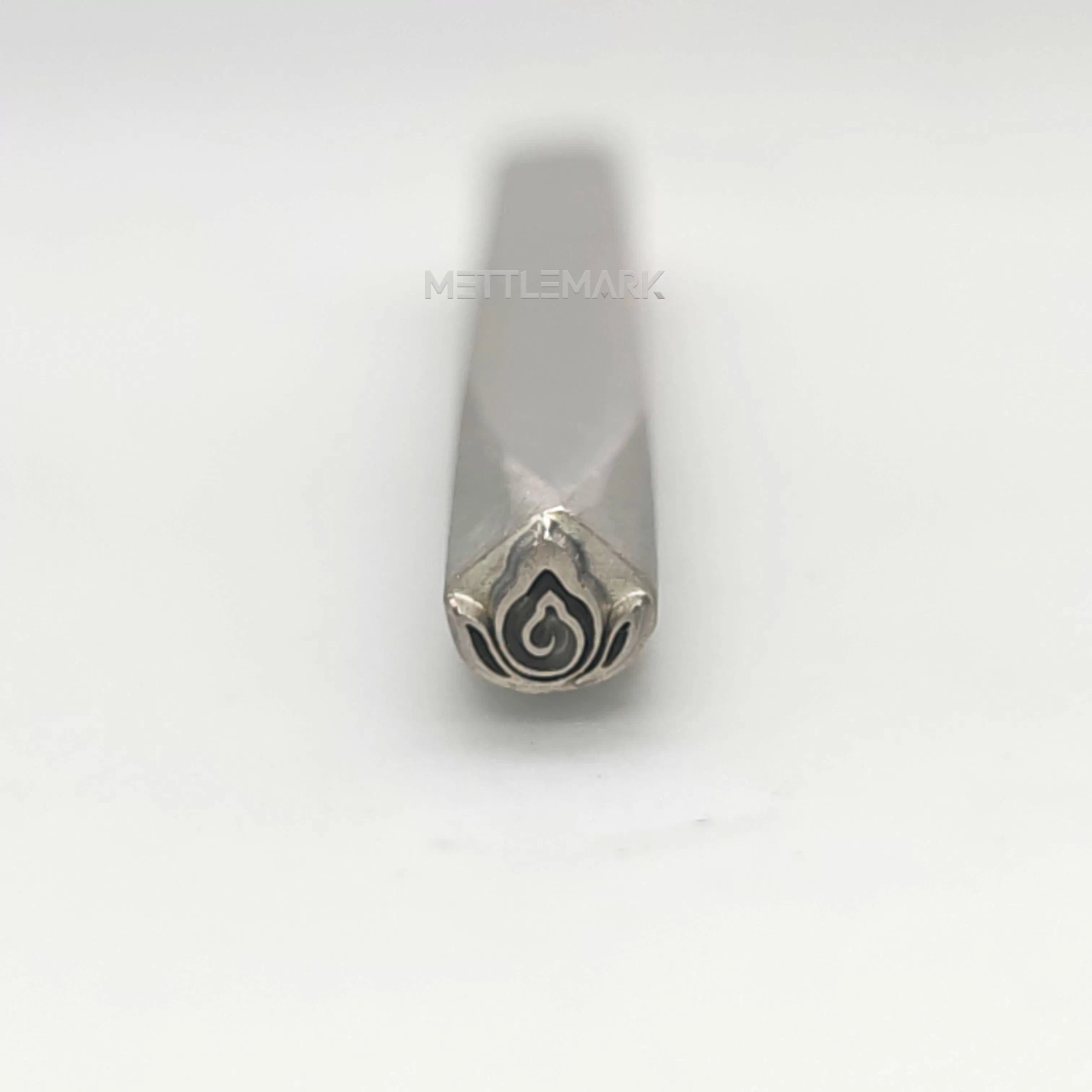 Metal stamp with a design on a white background