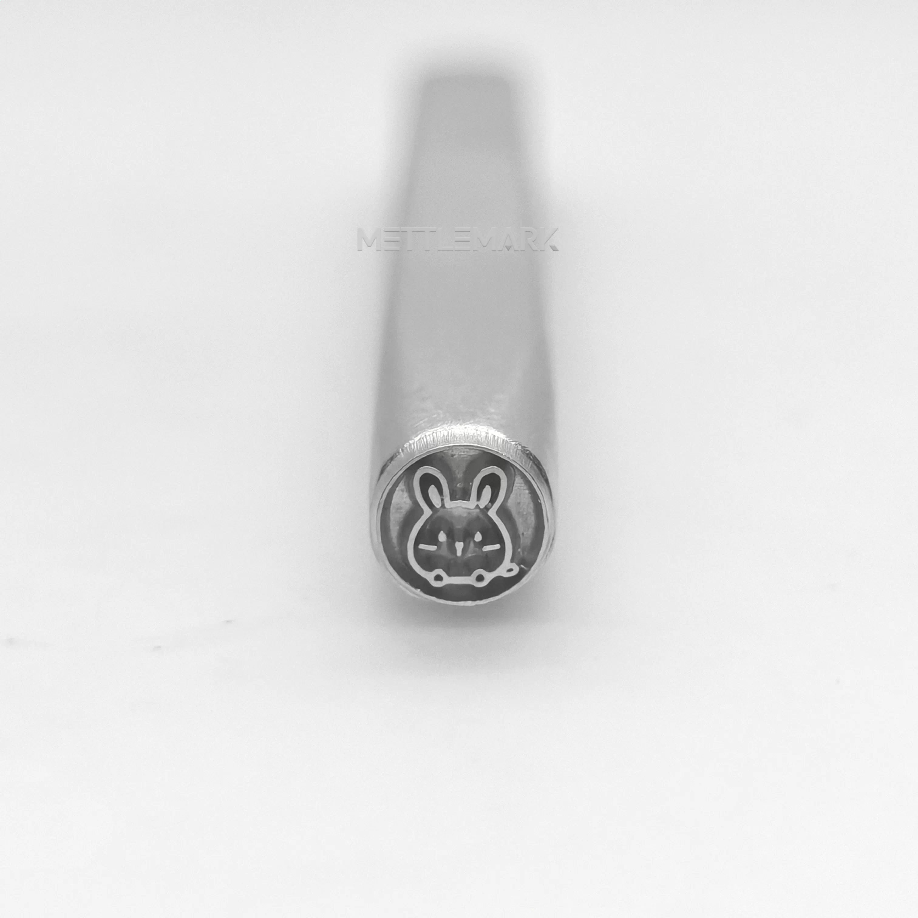 Metal stamp with a mouse design 
