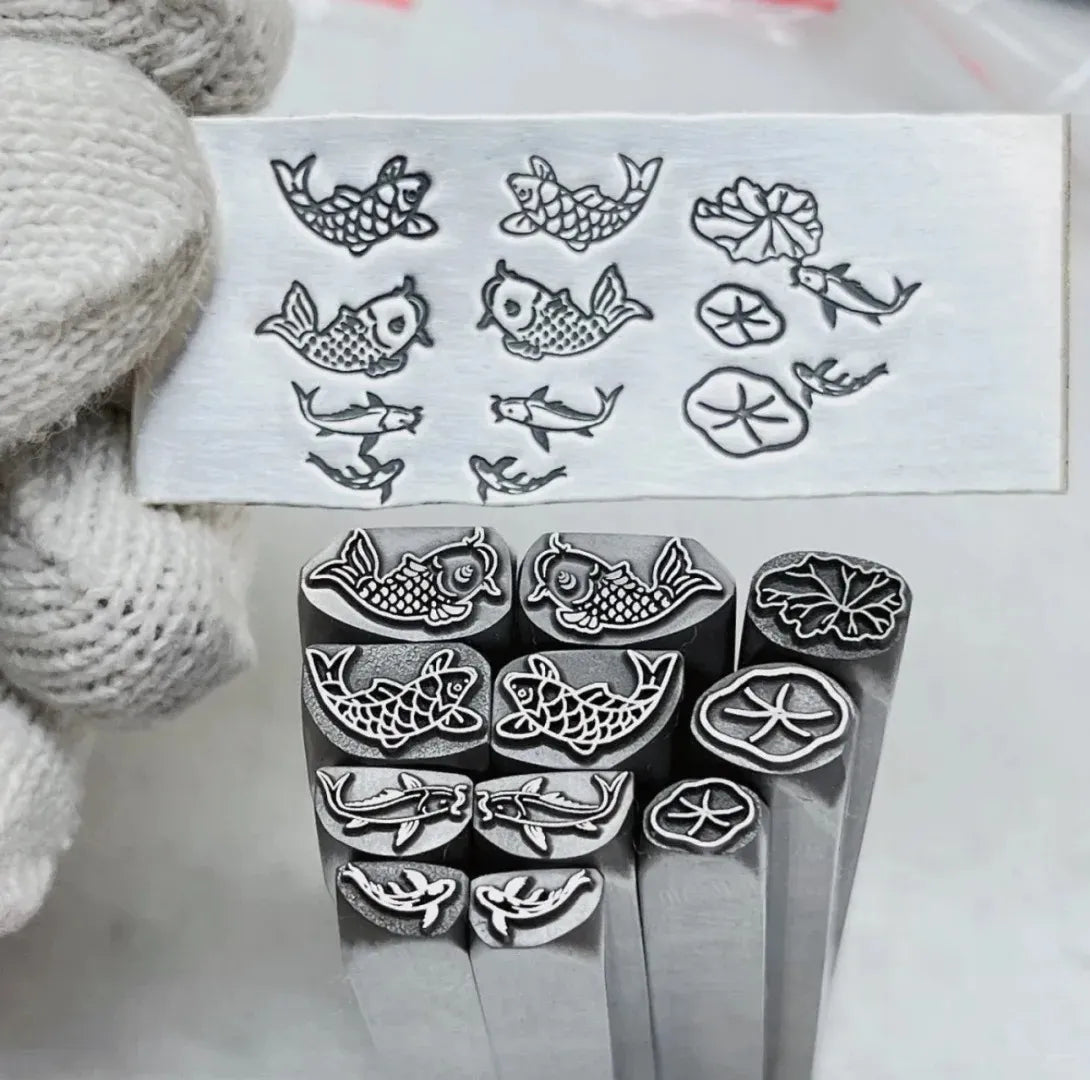 Set of rubber stamps with fish designs on a white background