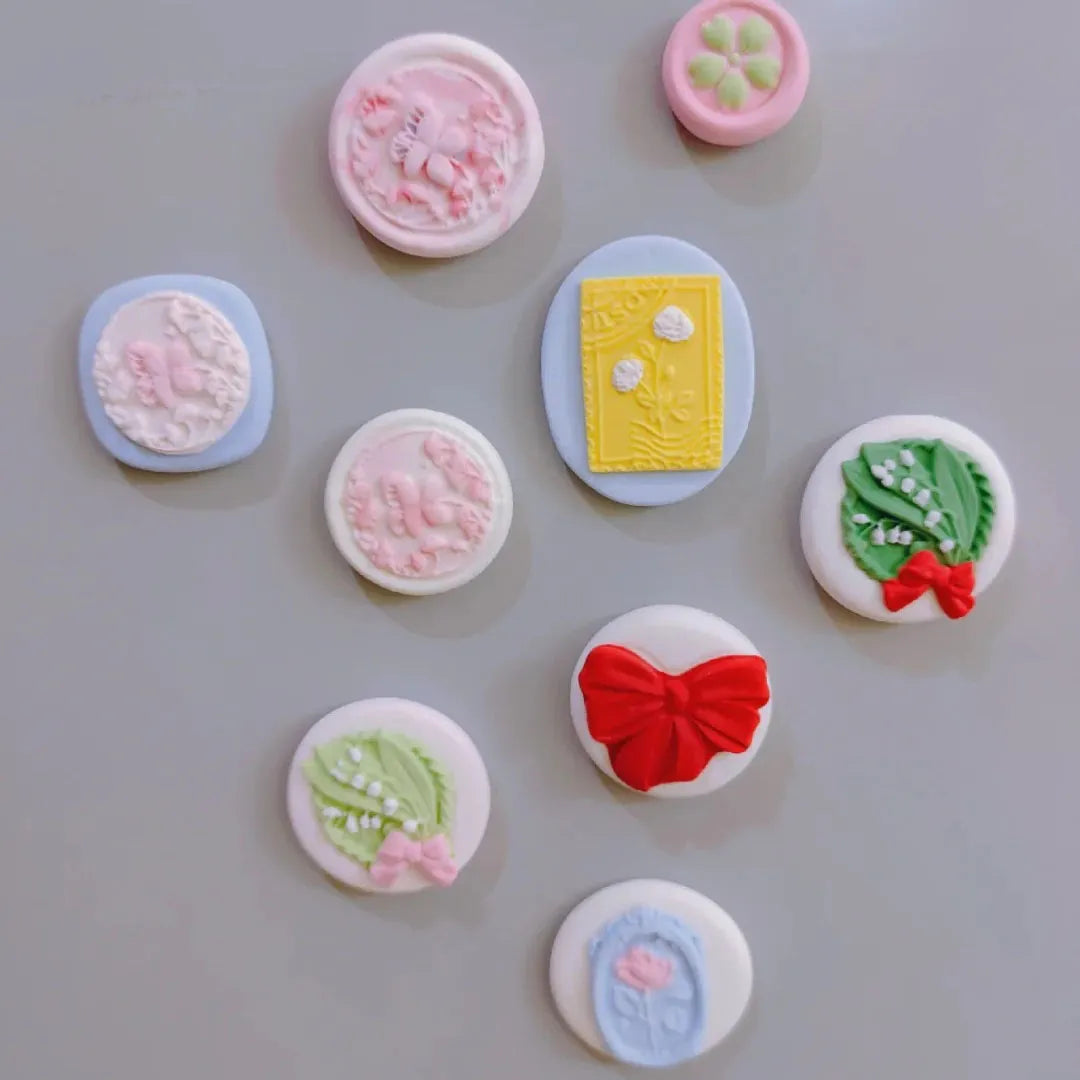 Decorative buttons with various designs on a gray background